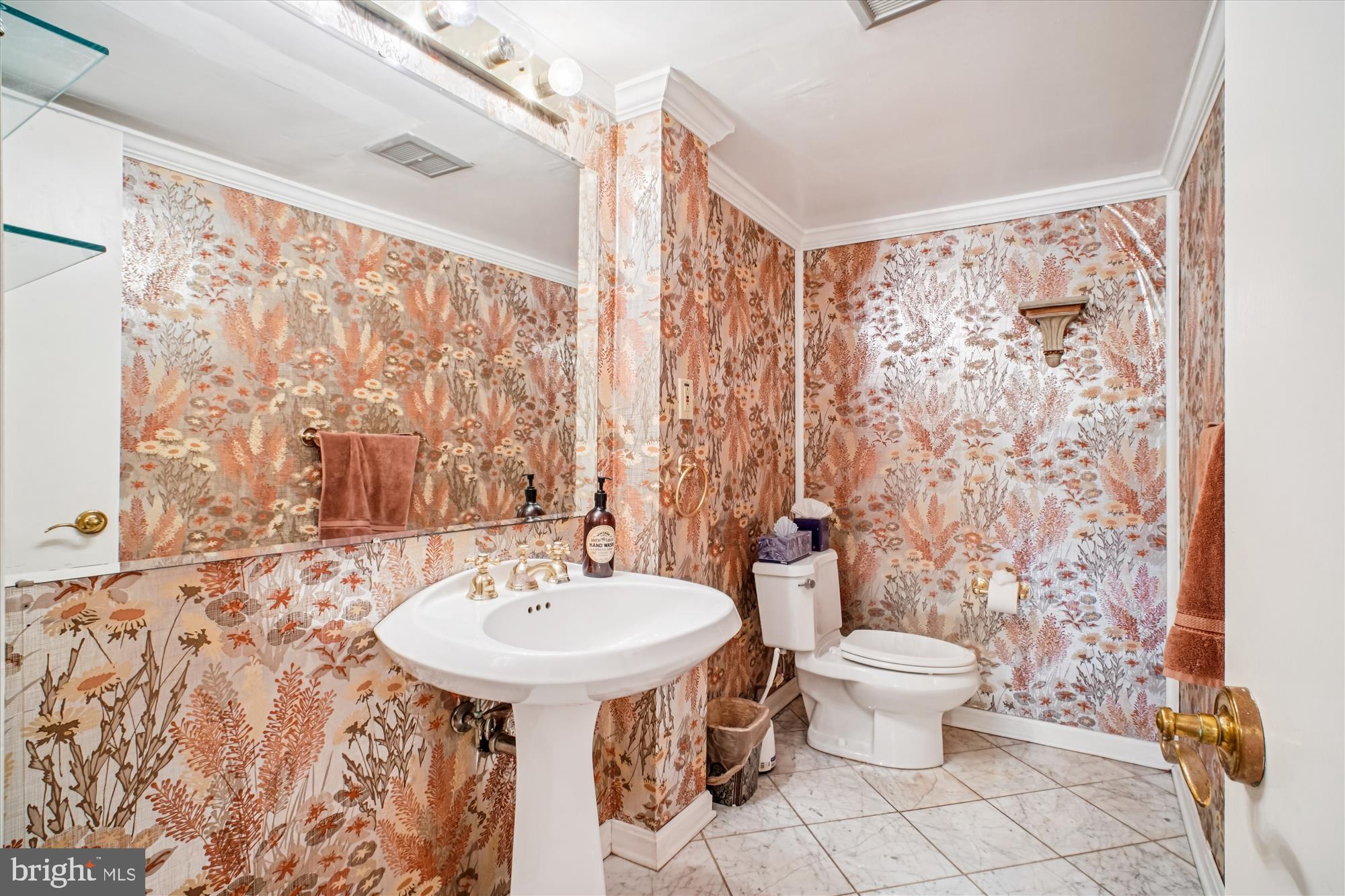 6144 Chesterbrook Road McLean, VA 22101 - Photo 14 of 53 a bathroom with a sink toilet and shower