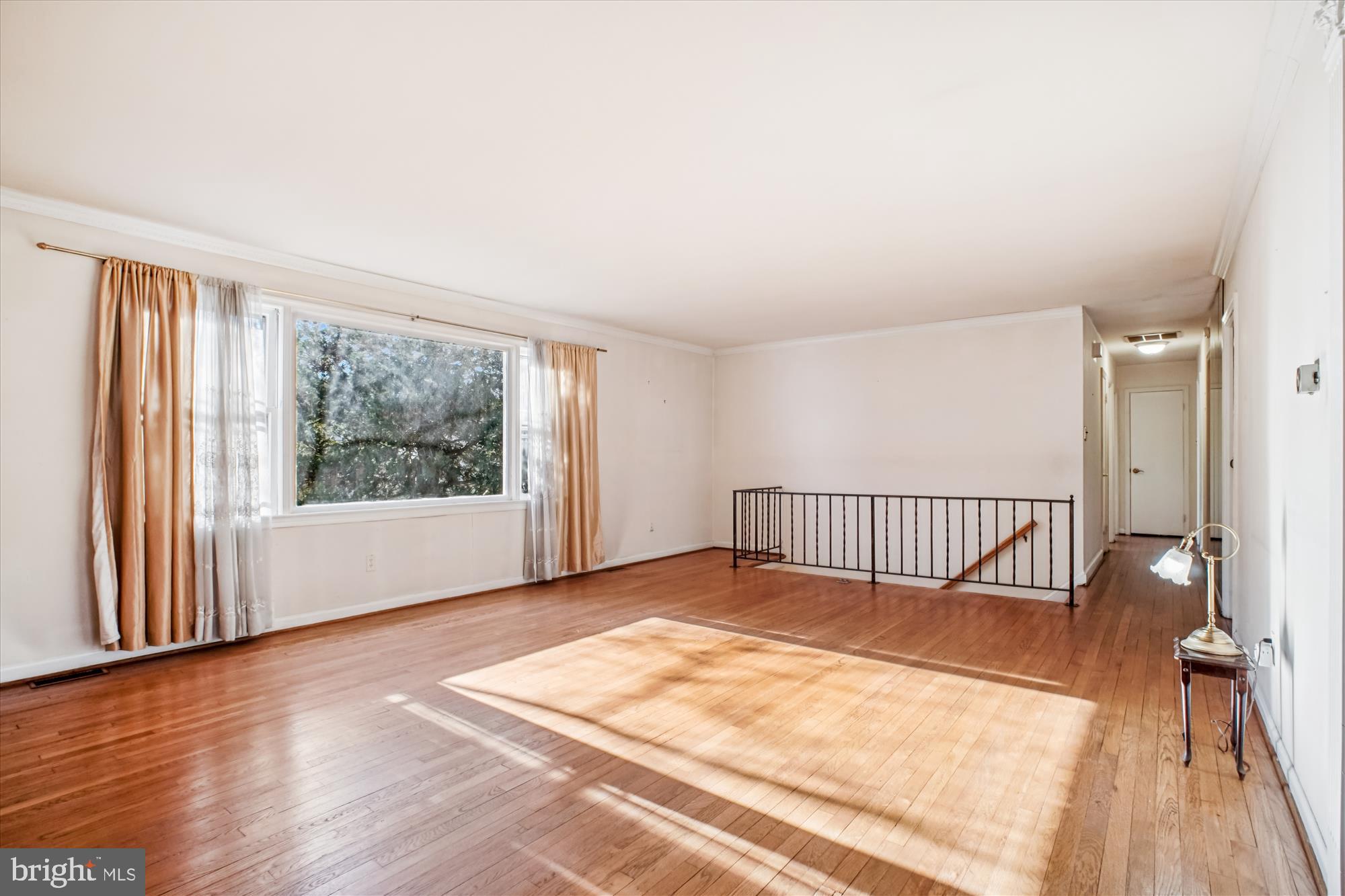 6144 Chesterbrook Road McLean, VA 22101 - Photo 22 of 50 a view of a room with wooden floor and large window