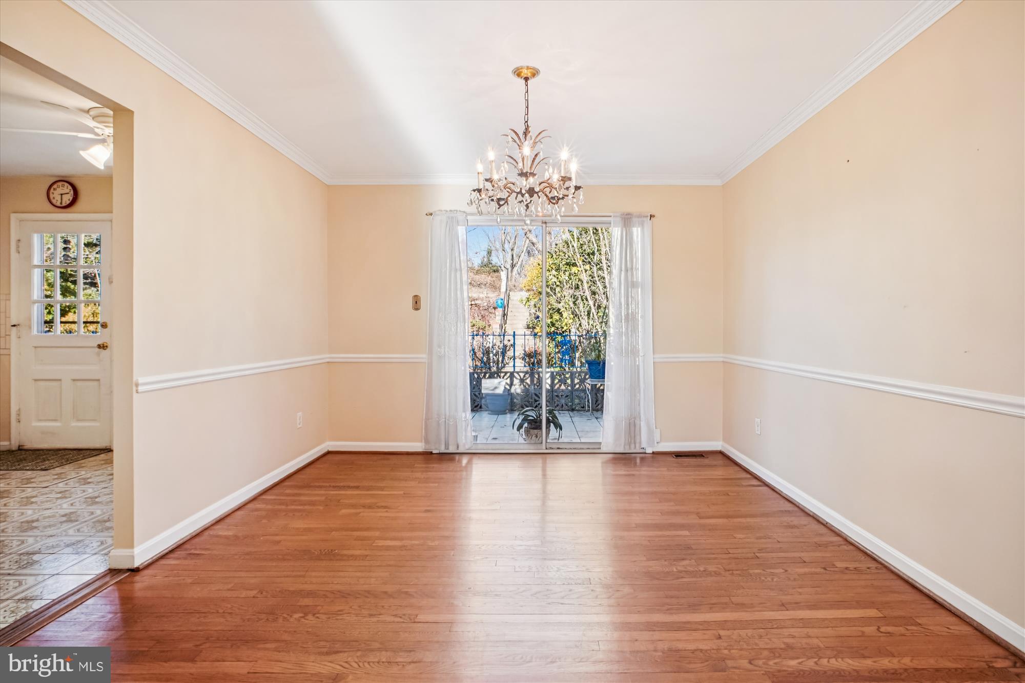 6144 Chesterbrook Road McLean, VA 22101 - Photo 23 of 50 a view of an empty room with wooden floor and a window