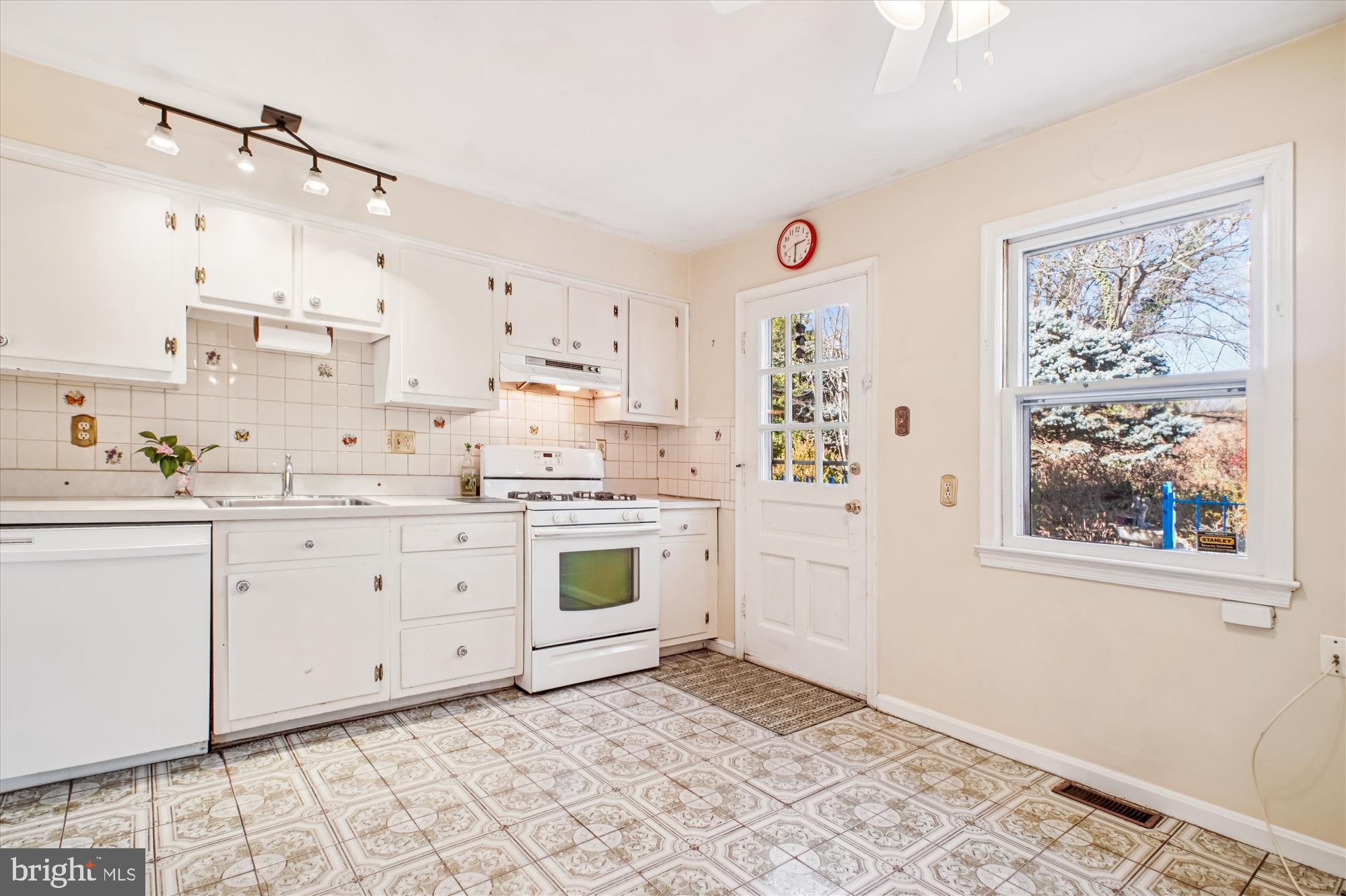 6144 Chesterbrook Road McLean, VA 22101 - Photo 26 of 50 a kitchen with granite countertop white cabinets and white appliances