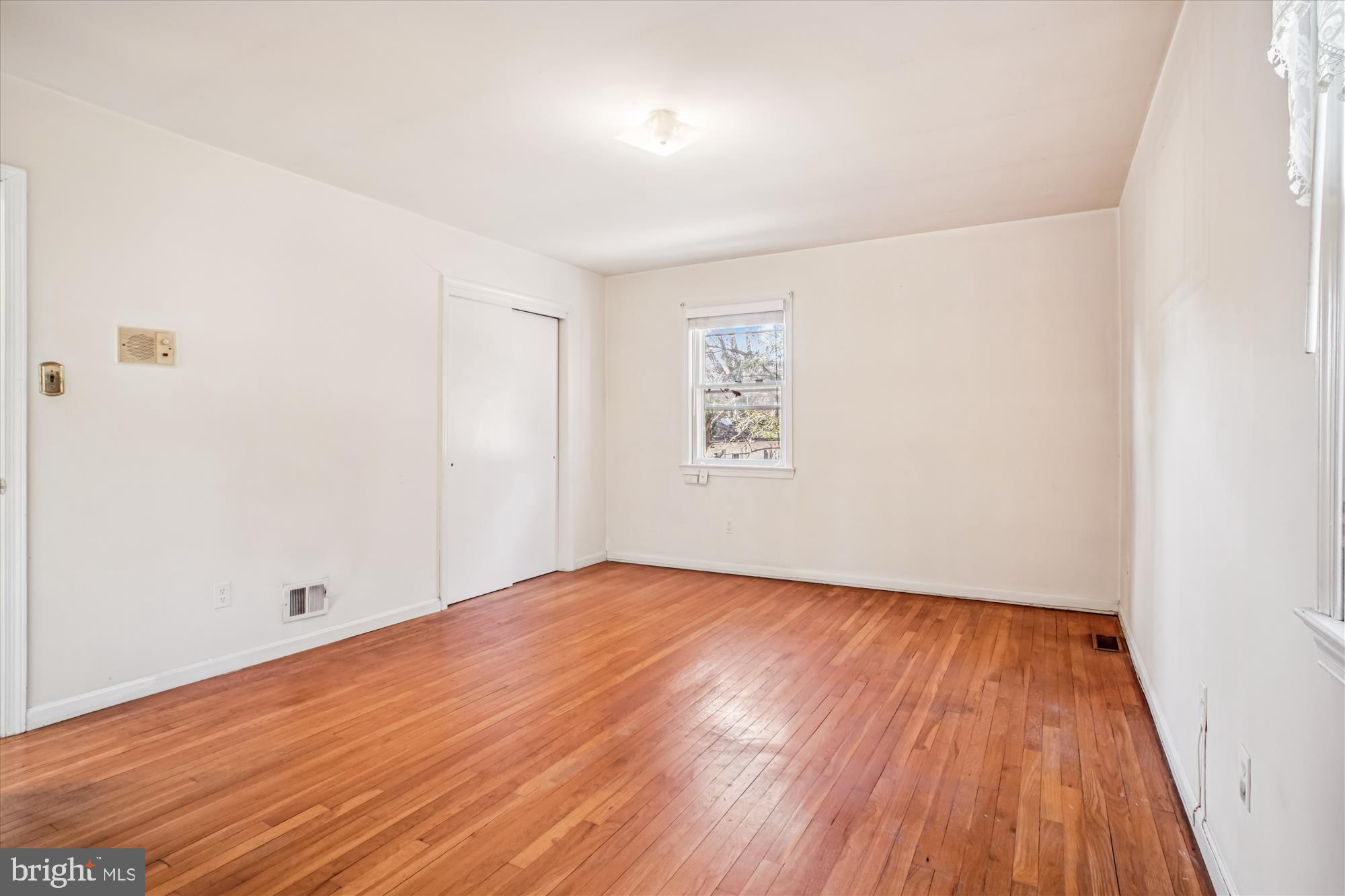 6144 Chesterbrook Road McLean, VA 22101 - Photo 27 of 50 an empty room with wooden floor and windows