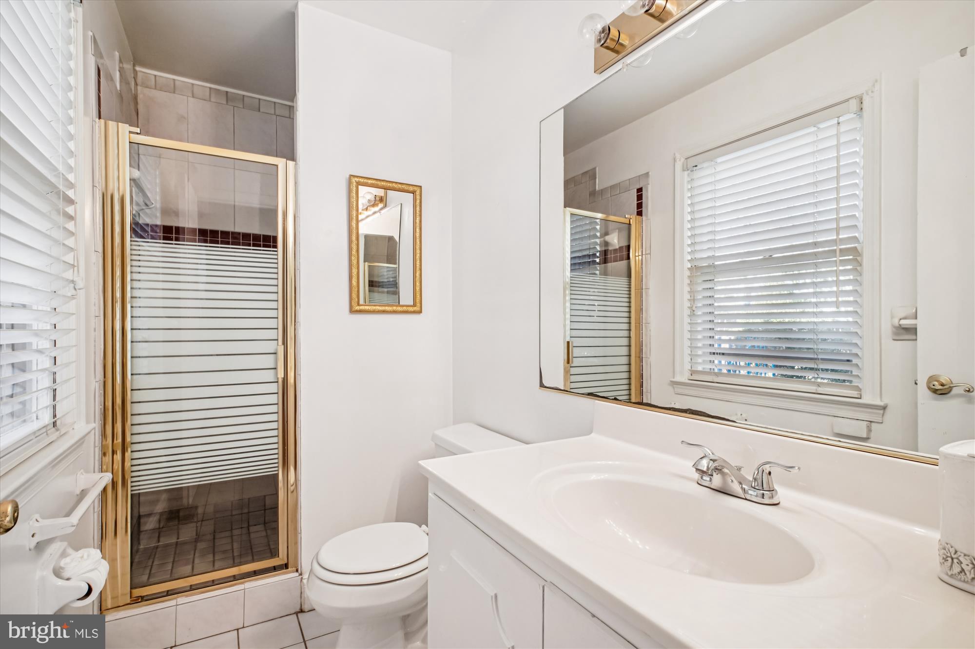6144 Chesterbrook Road McLean, VA 22101 - Photo 28 of 50 a bathroom with a sink toilet and shower