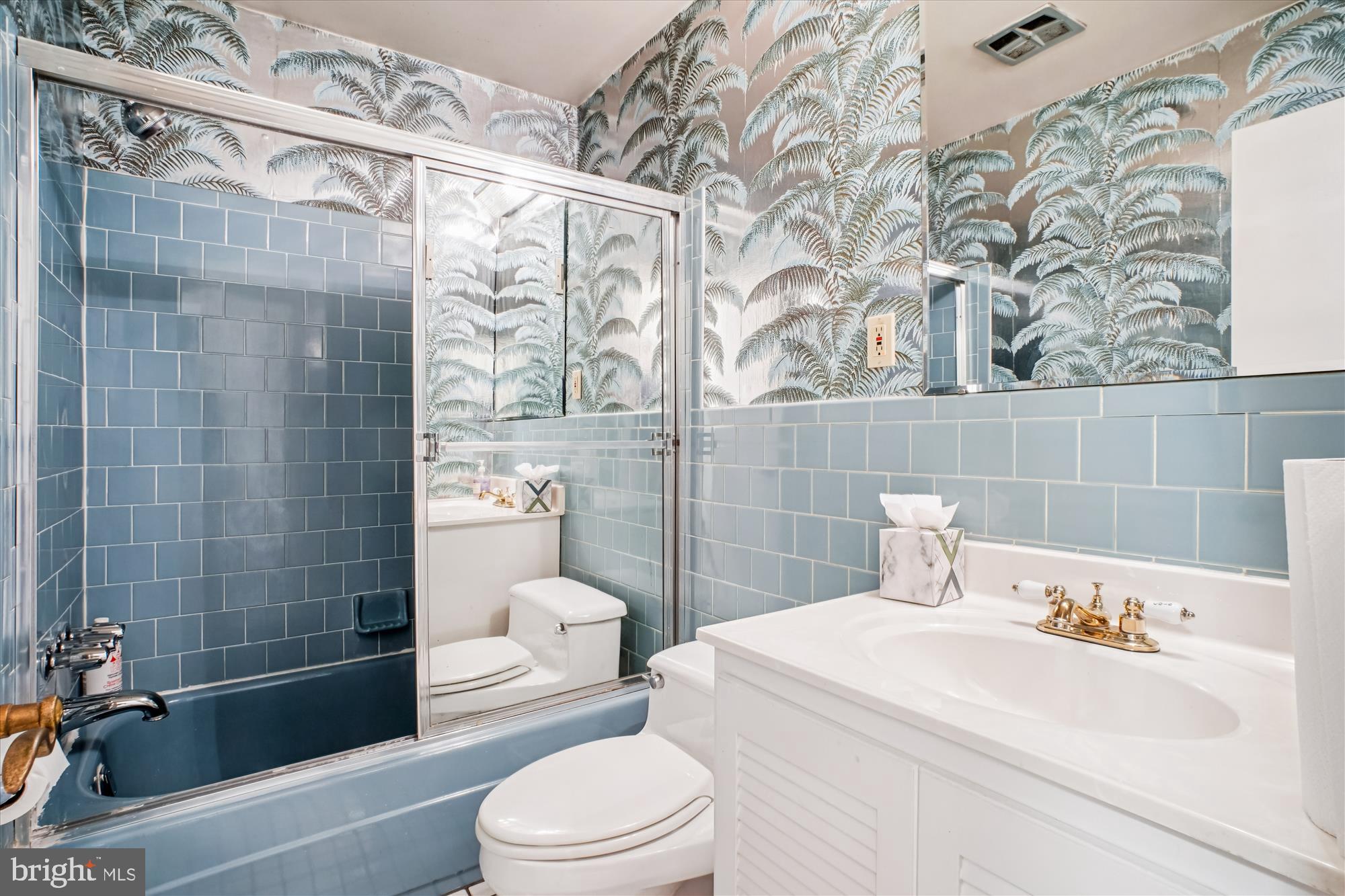 6144 Chesterbrook Road McLean, VA 22101 - Photo 29 of 50 a bathroom with a sink a toilet and shower