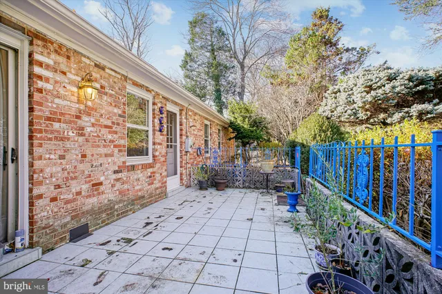 a backyard of a house with outdoor seating