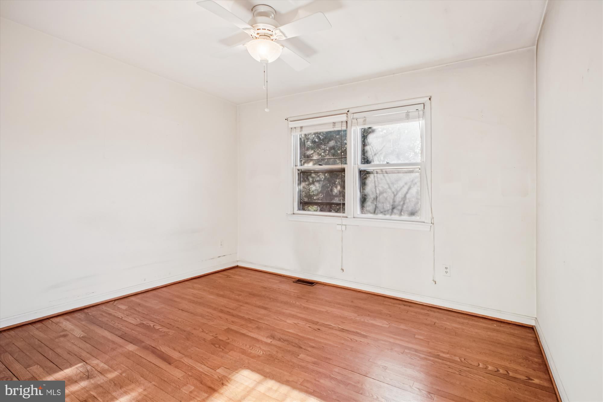 6144 Chesterbrook Road McLean, VA 22101 - Photo 31 of 50 an empty room with a window and a fan