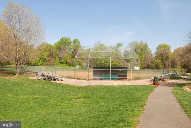 a view of a park with swings and slides