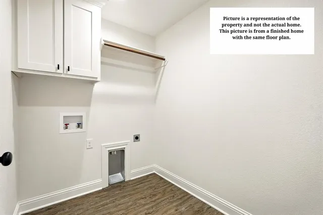 a view of a kitchen with white walls