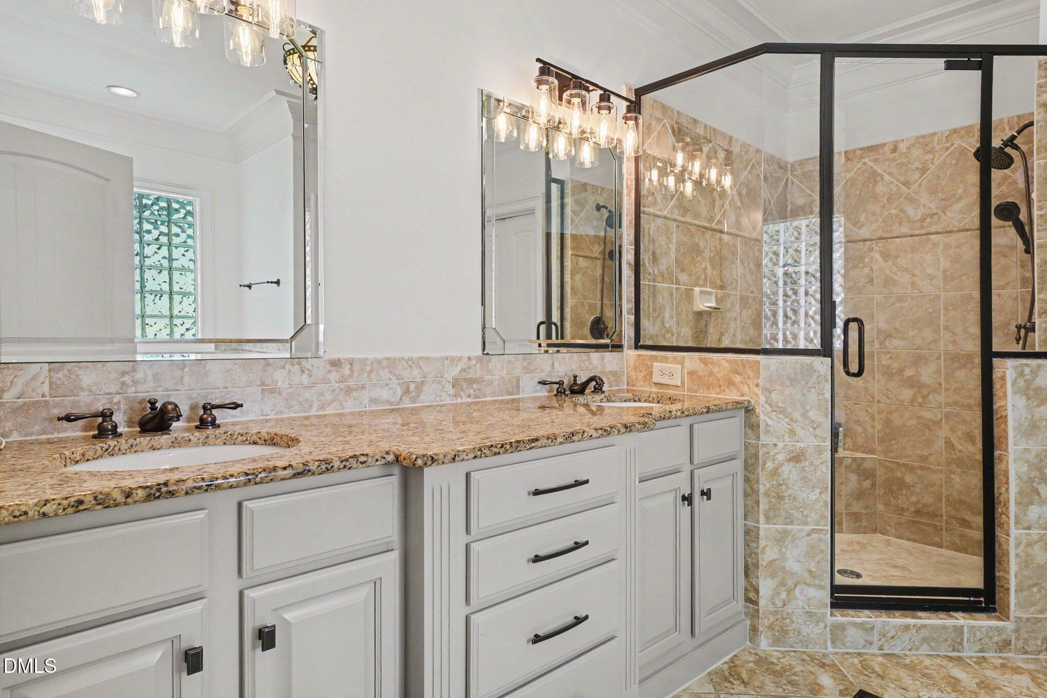 1729 Frenchwood Drive Raleigh, NC 27612 - Photo 33 of 46 a bathroom with a granite countertop sink mirror and double