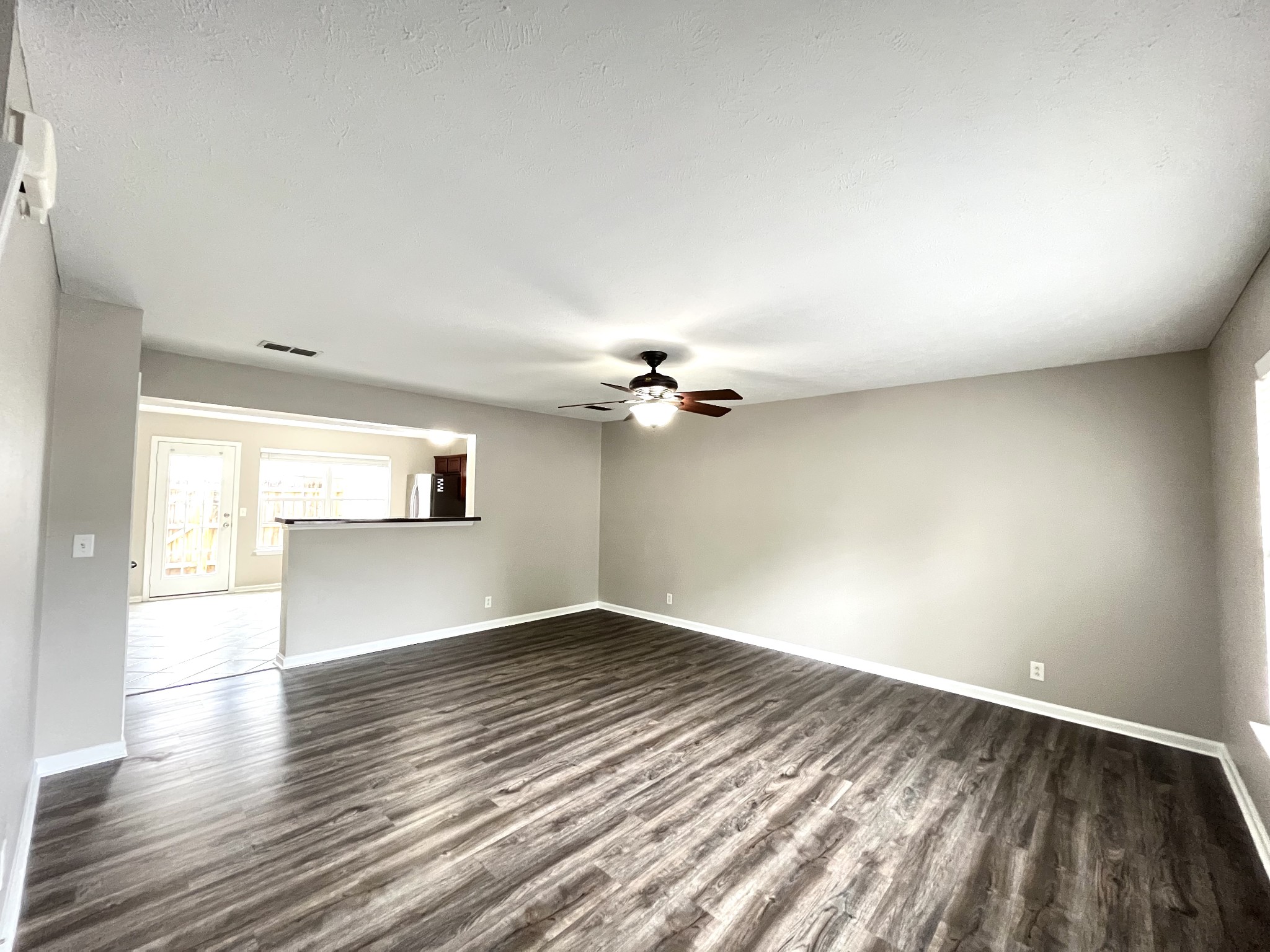 262 Arapaho Drive Murfreesboro, TN 37128 - Photo 3 of 24 wooden floor in an empty room with a window