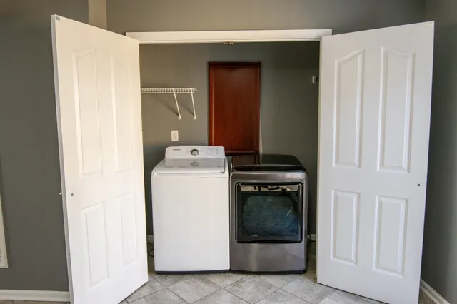a utility room with dryer and washer