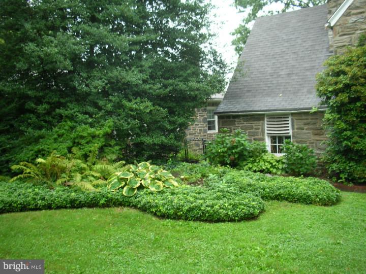 351 Mill Road Havertown, PA 19083 - Photo 21 of 24 a view of a house with a garden