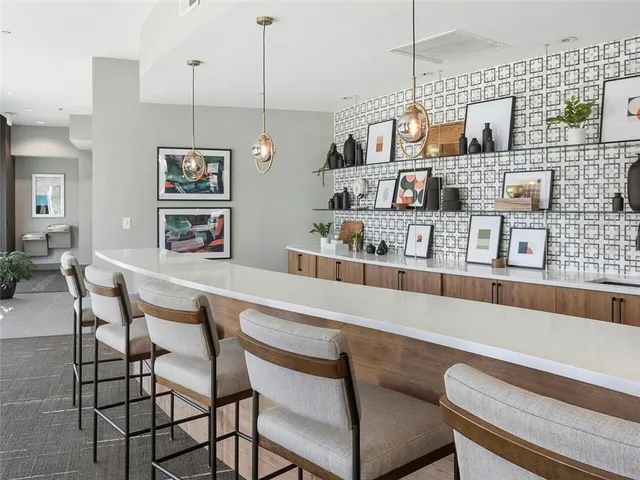 a view of a tall building next to a road