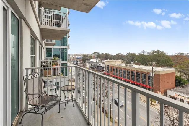a view of balcony with furniture