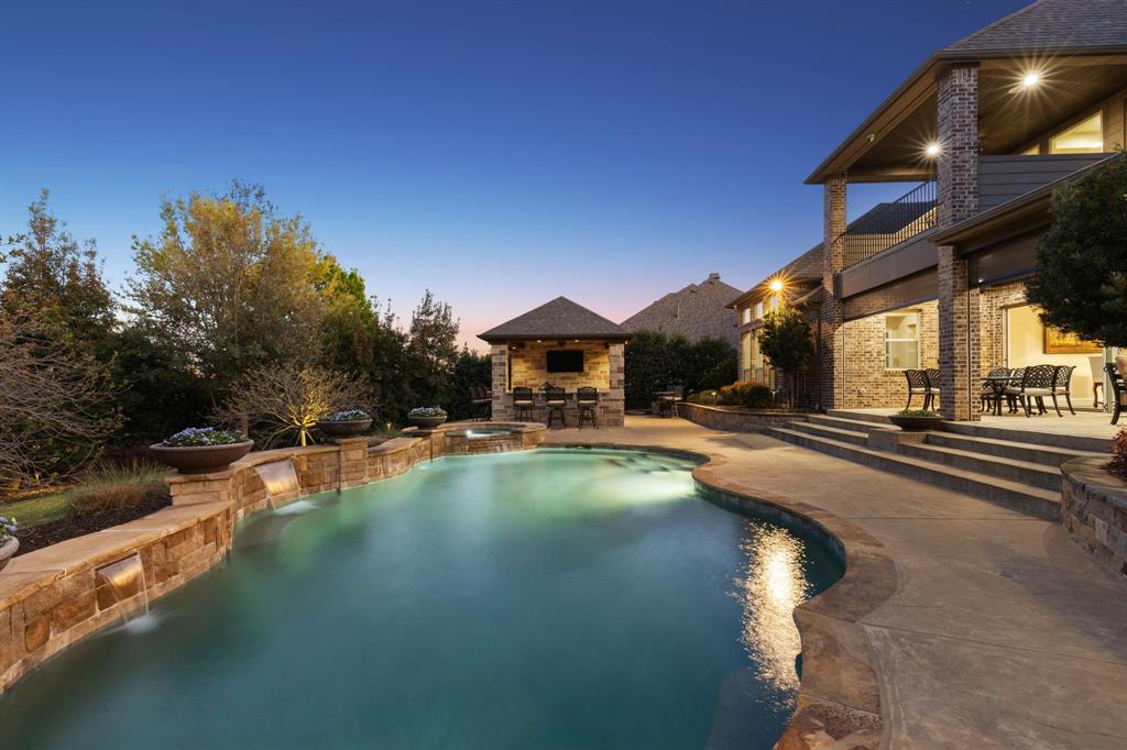 1005 Berkshire Road Southlake, TX 76092 - Photo 18 of 40 a swimming pool with outdoor seating and yard