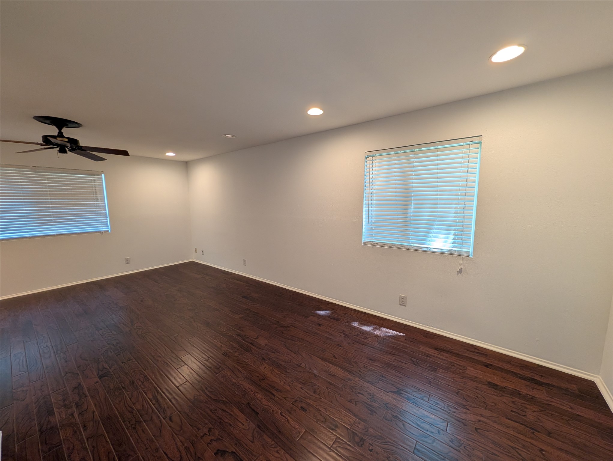 4601 Tamarack Trail Austin, TX 78727 - Photo 15 of 19 Rich hardwood floors complement this spacious room with abundant natural light.