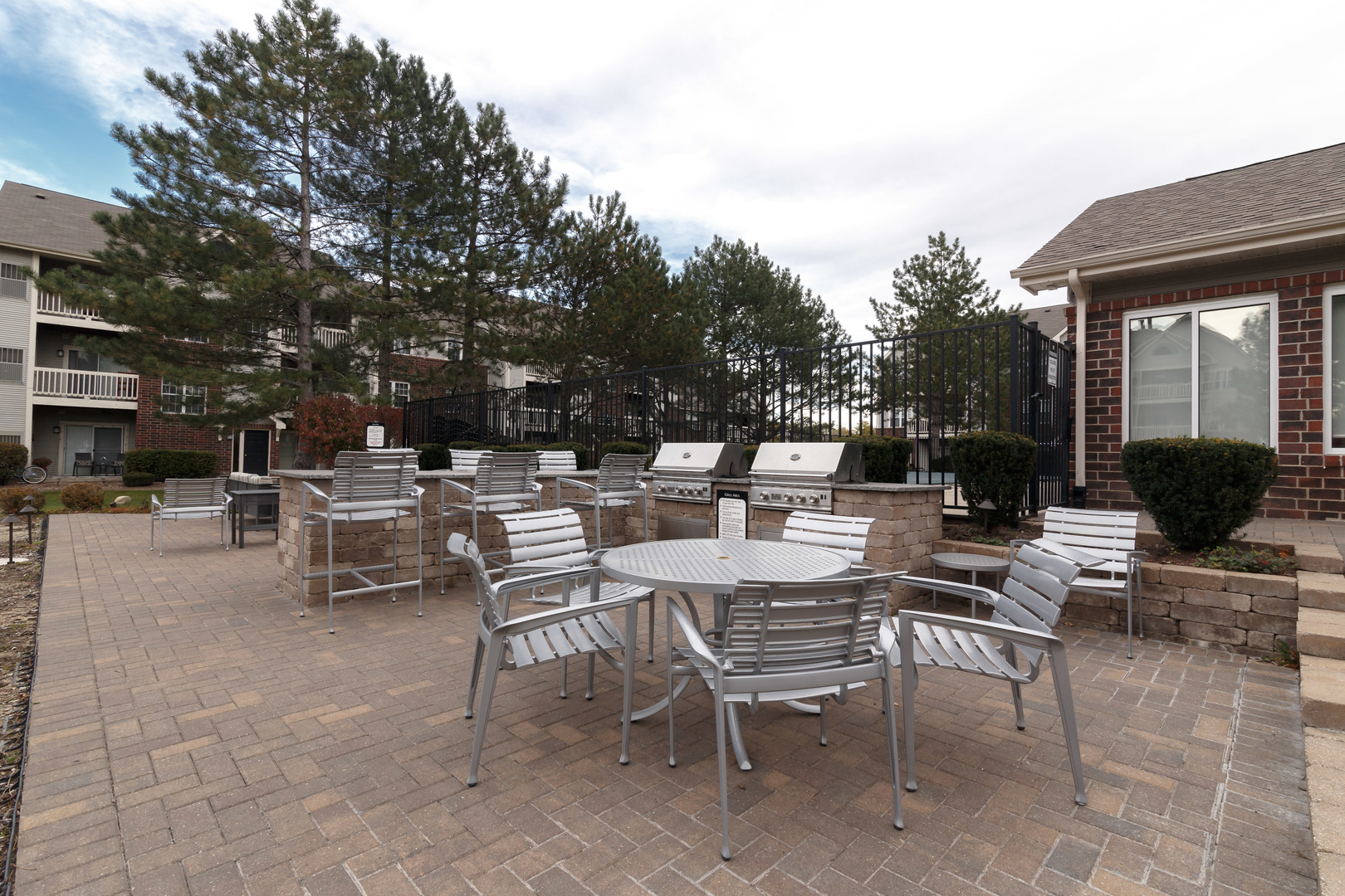 Undisclosed Address Wheaton, IL 60189 - Photo 13 of 17 a view of a patio with a table and chairs and potted plants