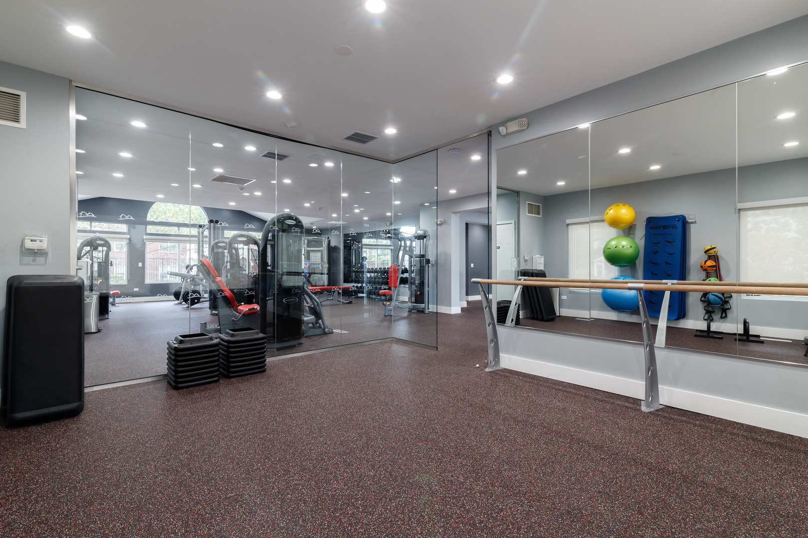 Undisclosed Address Wheaton, IL 60189 - Photo 15 of 17 a view of a room with gym equipment and a view of living room