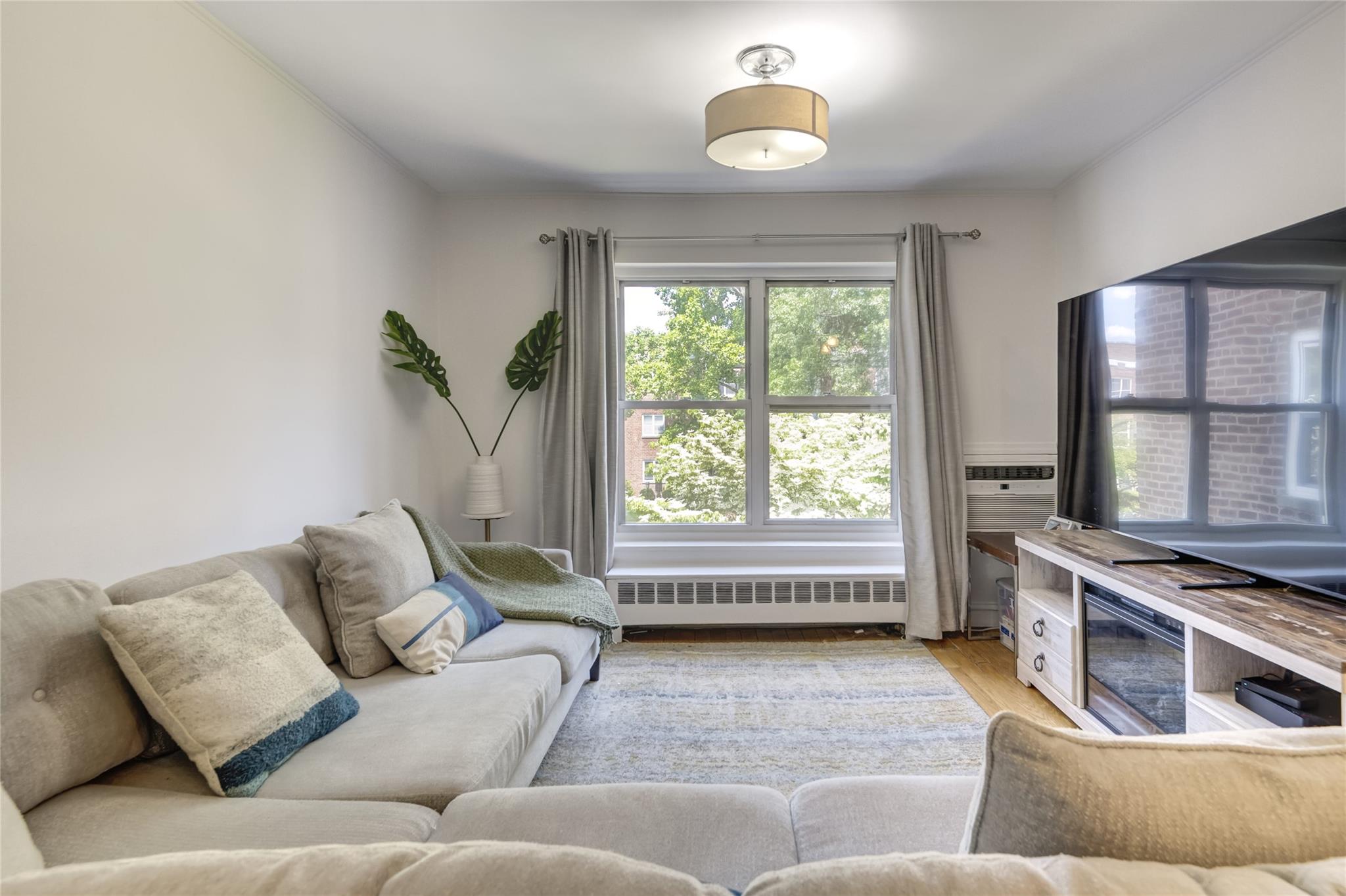 221 Middle Neck Road, Unit M4 Great Neck, NY 11021 - Photo 1 of 1 a living room with furniture and a window