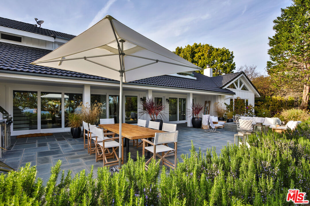 29225 Cliffside Drive Malibu, CA 90265 - Photo 16 of 33 a view of a house with backyard porch and sitting area