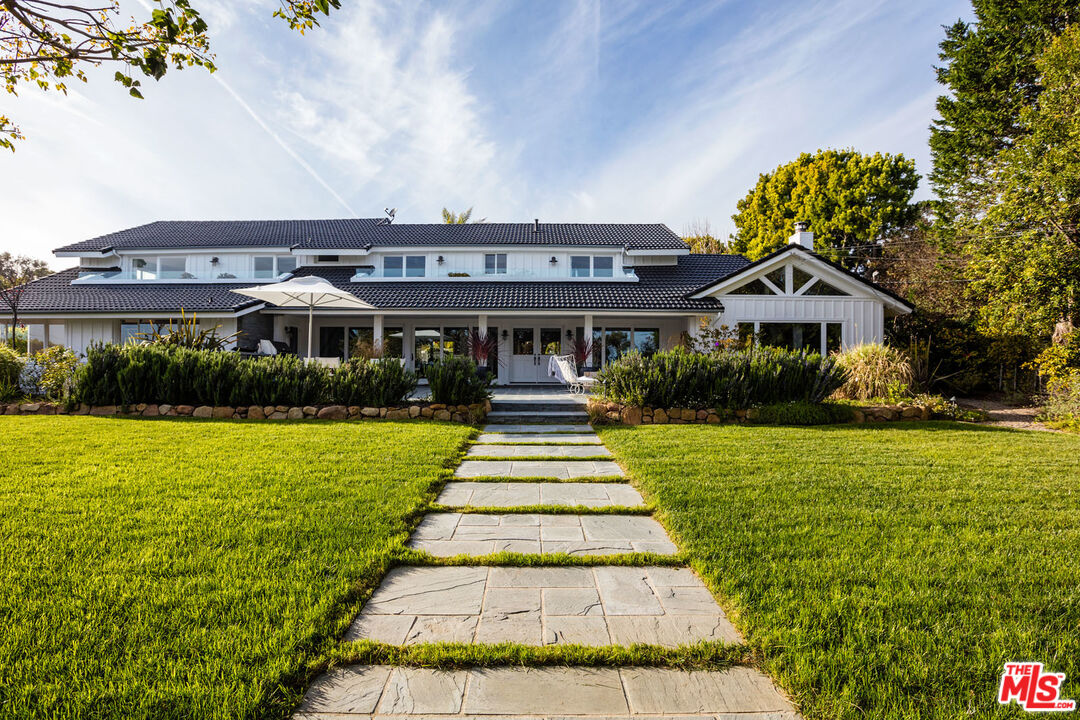 29225 Cliffside Drive Malibu, CA 90265 - Photo 2 of 33 a front view of a house with a yard
