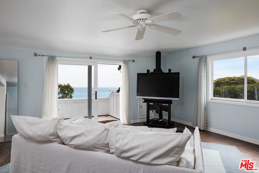 29225 Cliffside Drive Malibu, CA 90265 - Photo 21 of 33 a living room with furniture tv and a window
