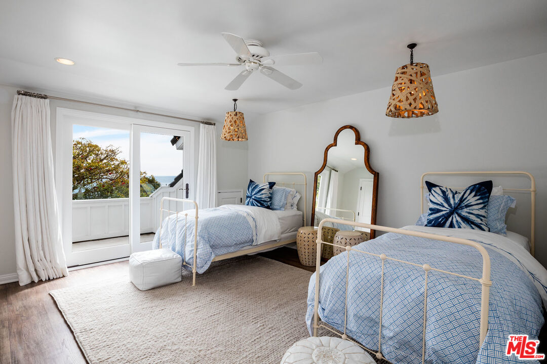 29225 Cliffside Drive Malibu, CA 90265 - Photo 25 of 33 a bedroom with two beds and a window