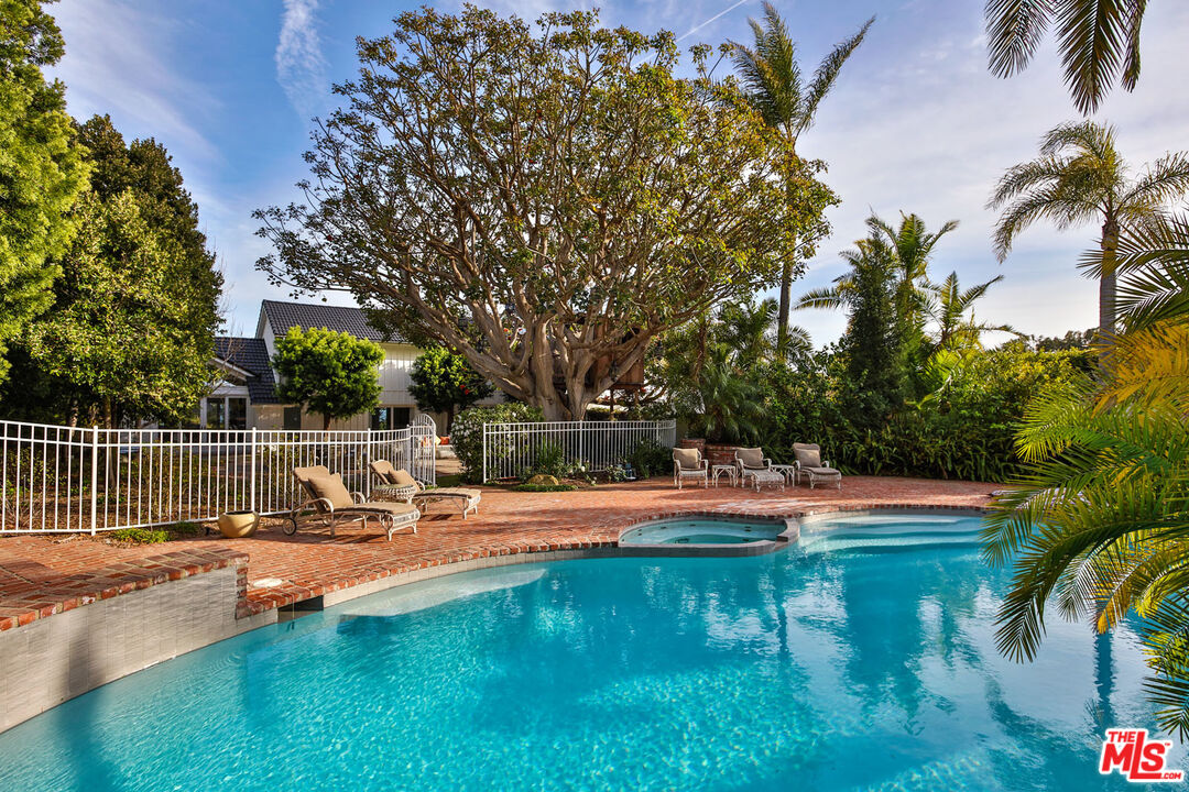 29225 Cliffside Drive Malibu, CA 90265 - Photo 31 of 33 a view of swimming pool with lawn chairs and plants