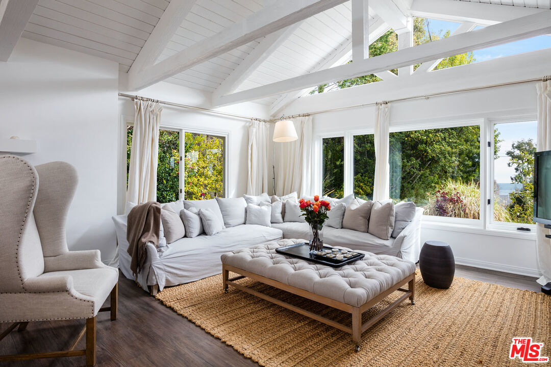 29225 Cliffside Drive Malibu, CA 90265 - Photo 7 of 33 a living room with furniture and a wooden floor
