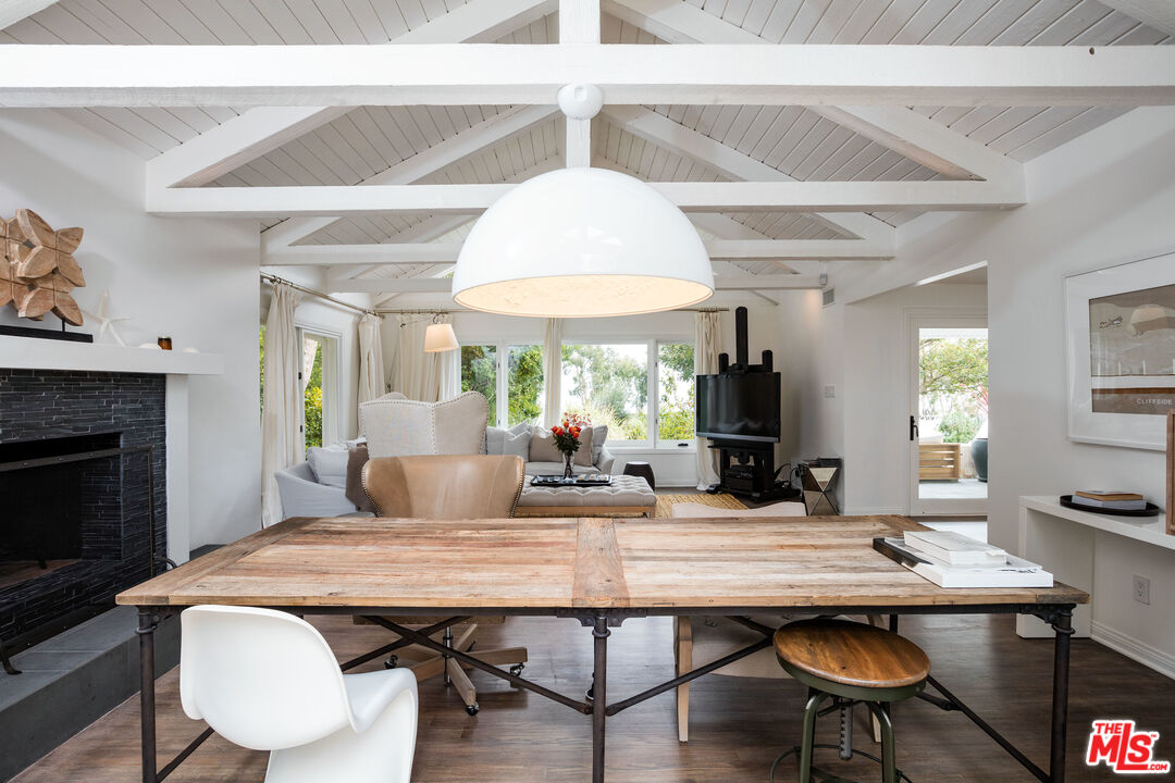 29225 Cliffside Drive Malibu, CA 90265 - Photo 10 of 33 a view of a dining room with furniture window and wooden floor