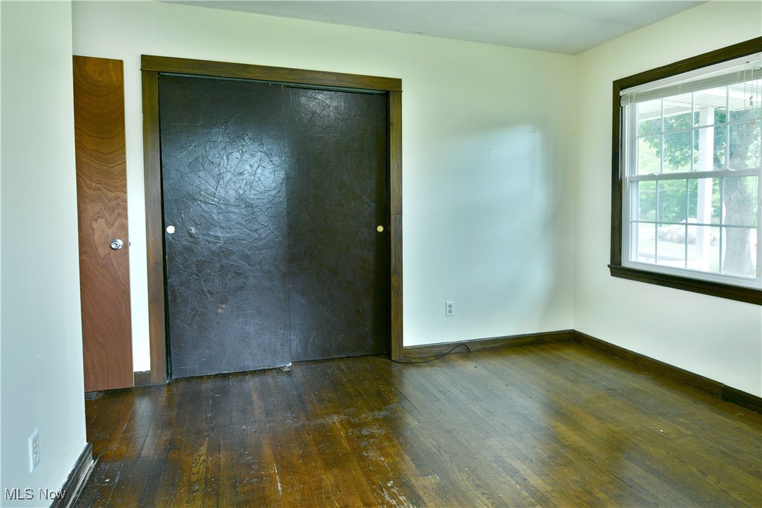 1141 Howell Road East Palestine, OH 44413 - Photo 29 of 41 Unfurnished bedroom featuring dark wood-type flooring and a closet