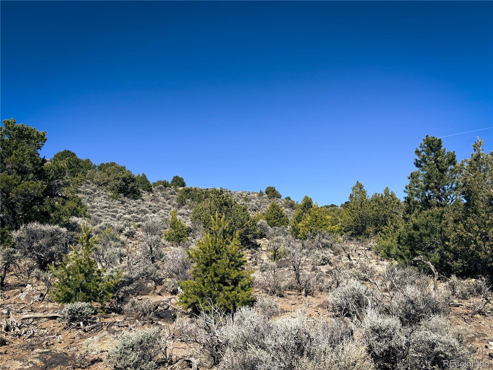 0 Sanchez Reservoir Road San Luis, CO 81152 - Photo 2 of 22 a view of a large building with a mountain in the background