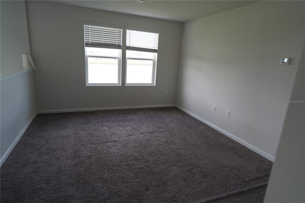 2850 Wadeview Loop St. Cloud, FL 34769 - Photo 12 of 17 an empty room with a window
