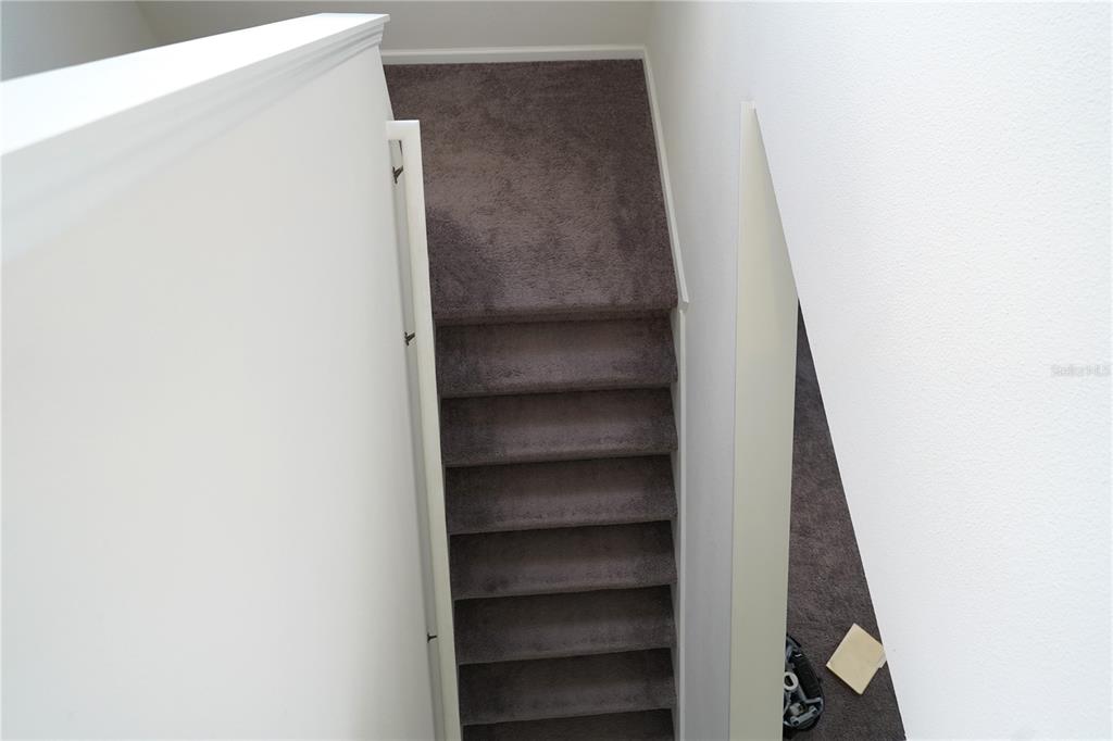 2850 Wadeview Loop St. Cloud, FL 34769 - Photo 13 of 17 a view of staircase with white walls