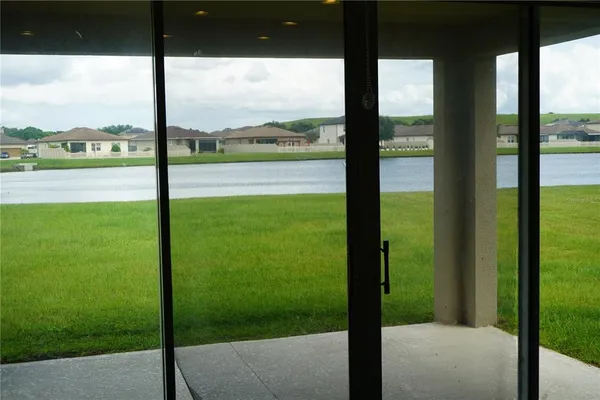 a view of an outdoor space and floor to ceiling window