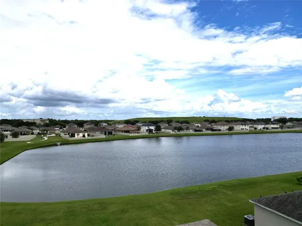 a view of a lake with a city