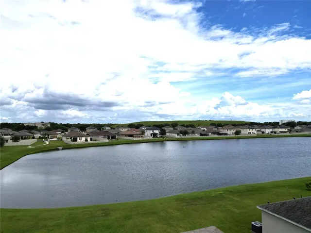 a view of a lake with a city