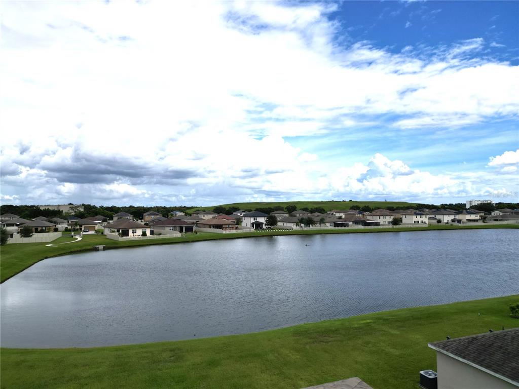 2850 Wadeview Loop St. Cloud, FL 34769 - Photo 2 of 17 a view of a lake with a city