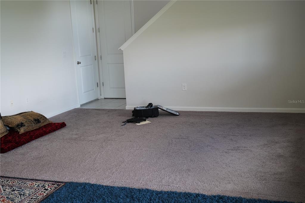 2850 Wadeview Loop St. Cloud, FL 34769 - Photo 8 of 17 a room with a bed