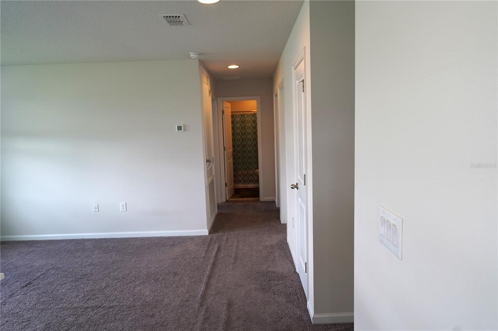2850 Wadeview Loop St. Cloud, FL 34769 - Photo 10 of 17 wooden floor in an empty room
