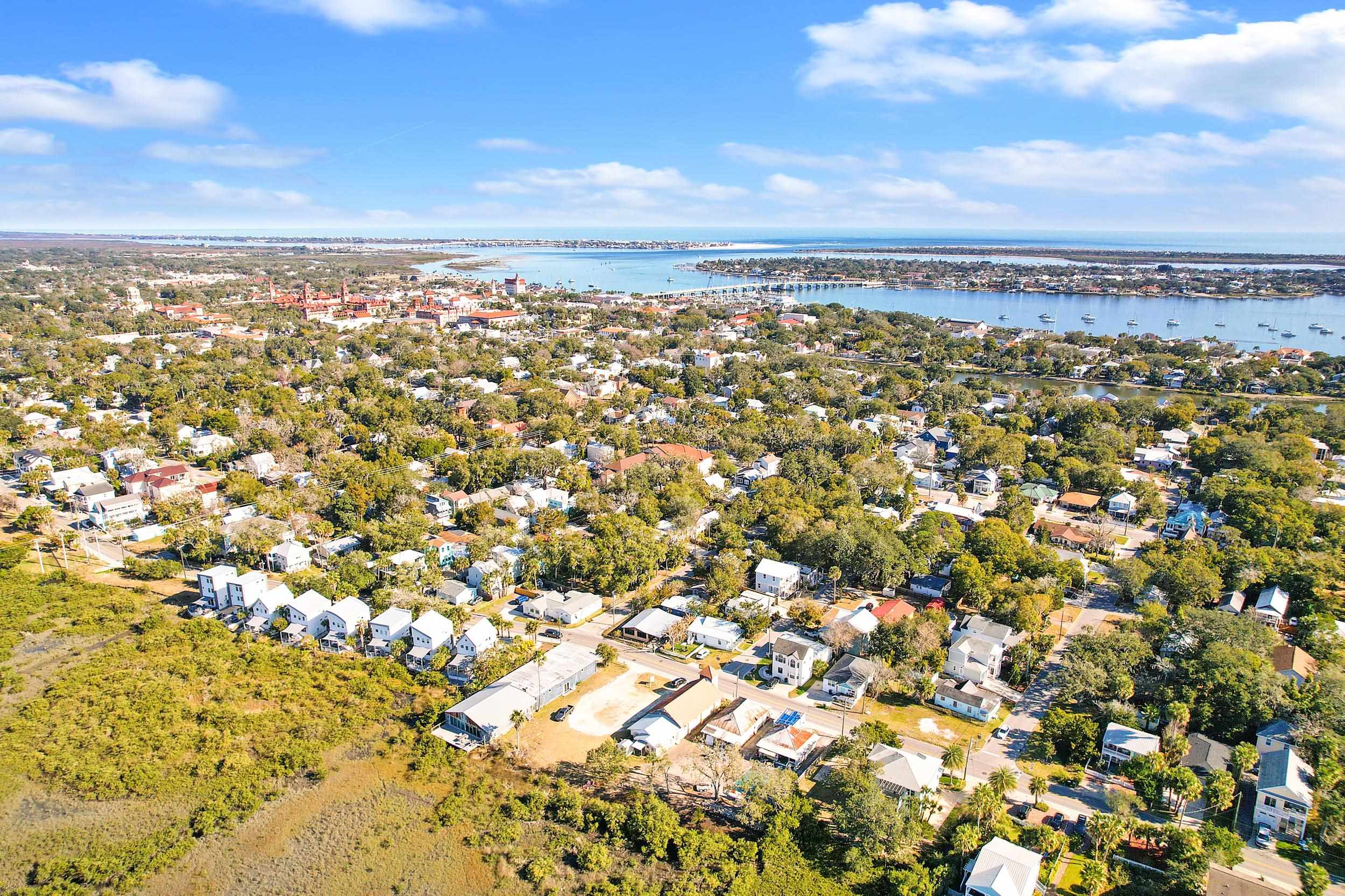 224 Riberia Street St. Augustine, FL 32084 - Photo 4 of 10 Aerial view of property and surrounding area featuring nearby suburban area and a large body of water