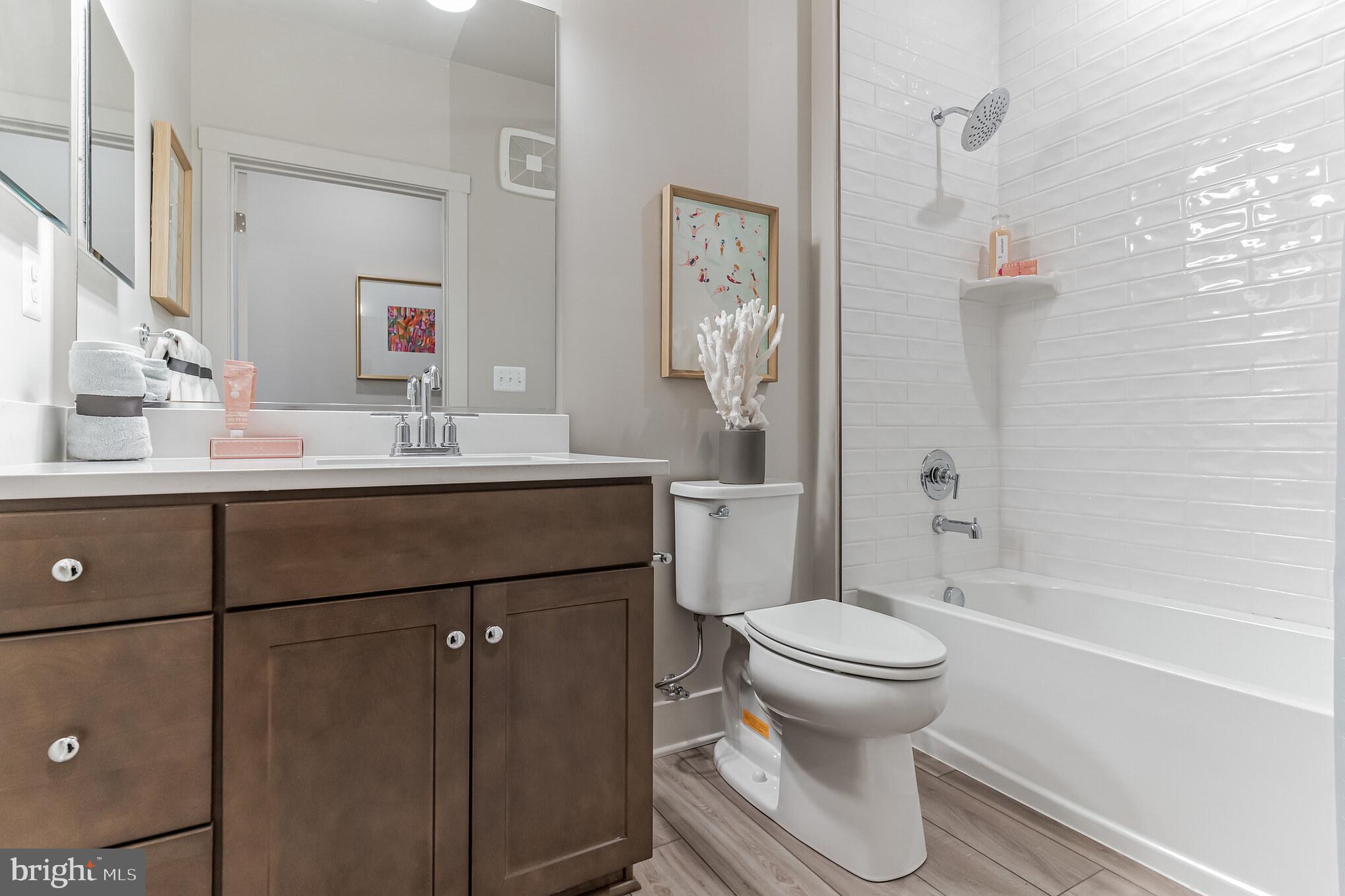 132 Wheelhouse Way Chester, MD 21619 - Photo 13 of 66 a bathroom with a sink toilet and shower