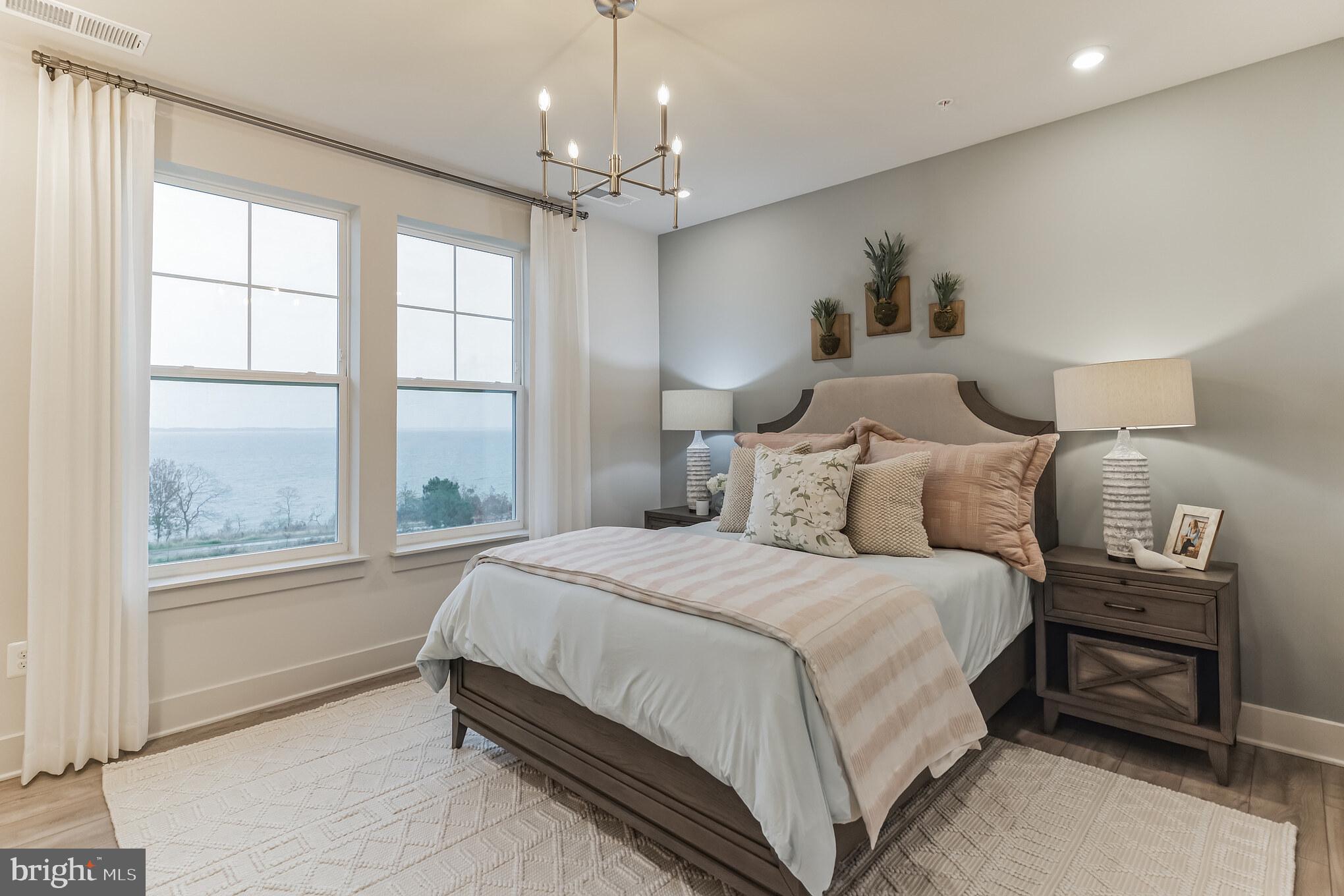 132 Wheelhouse Way Chester, MD 21619 - Photo 14 of 66 a spacious bedroom with a bed and a window
