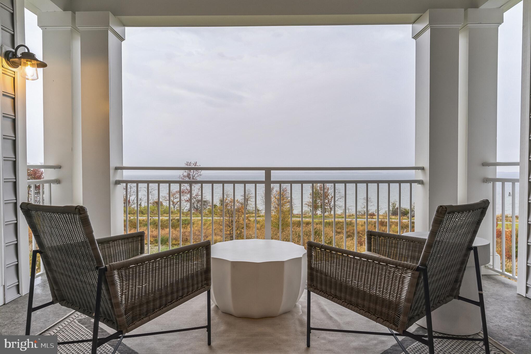 132 Wheelhouse Way Chester, MD 21619 - Photo 21 of 66 a view of a chair and table on the balcony