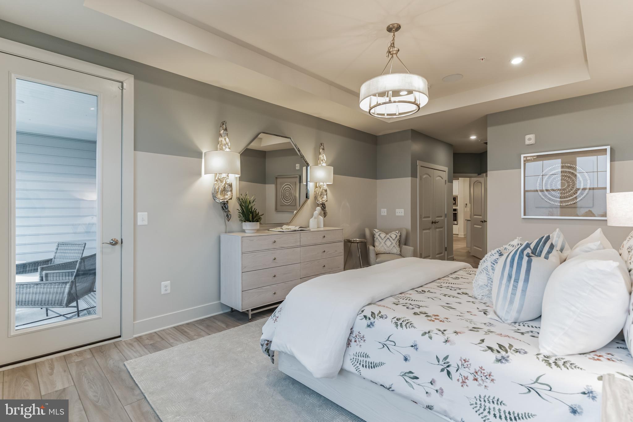 132 Wheelhouse Way Chester, MD 21619 - Photo 25 of 66 a bedroom with a bed and a chandelier