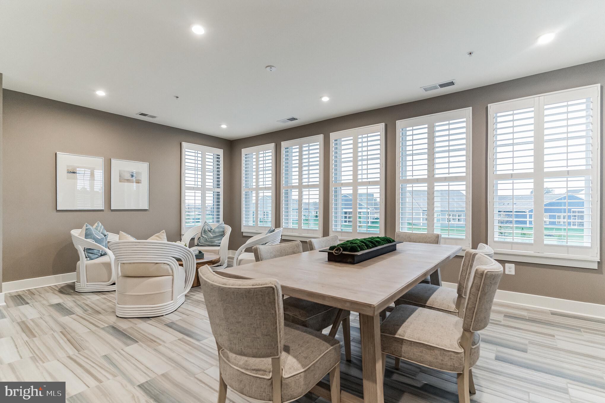 132 Wheelhouse Way Chester, MD 21619 - Photo 3 of 66 a view of a dining room with furniture and windows