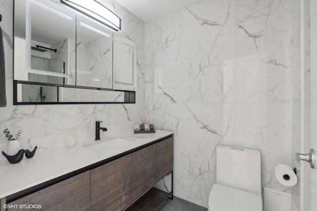 a bathroom with a sink and mirror