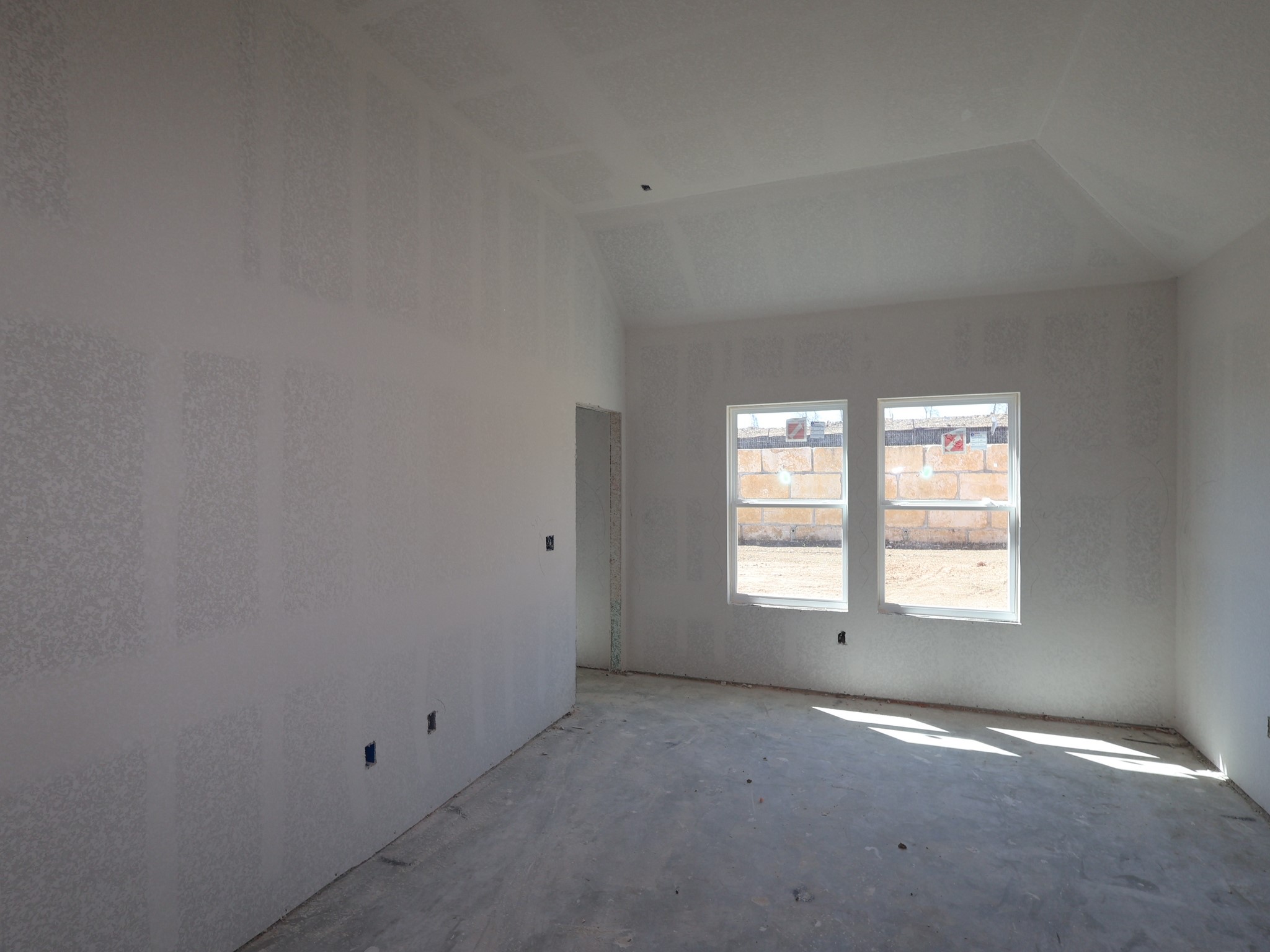 4513 Lava Island Drive Austin, TX 78747 - Photo 7 of 22 an empty room with a windows and closet