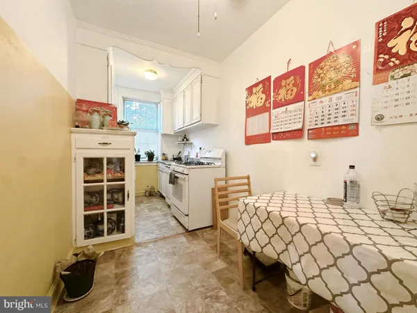a kitchen with a sink and a stove top oven