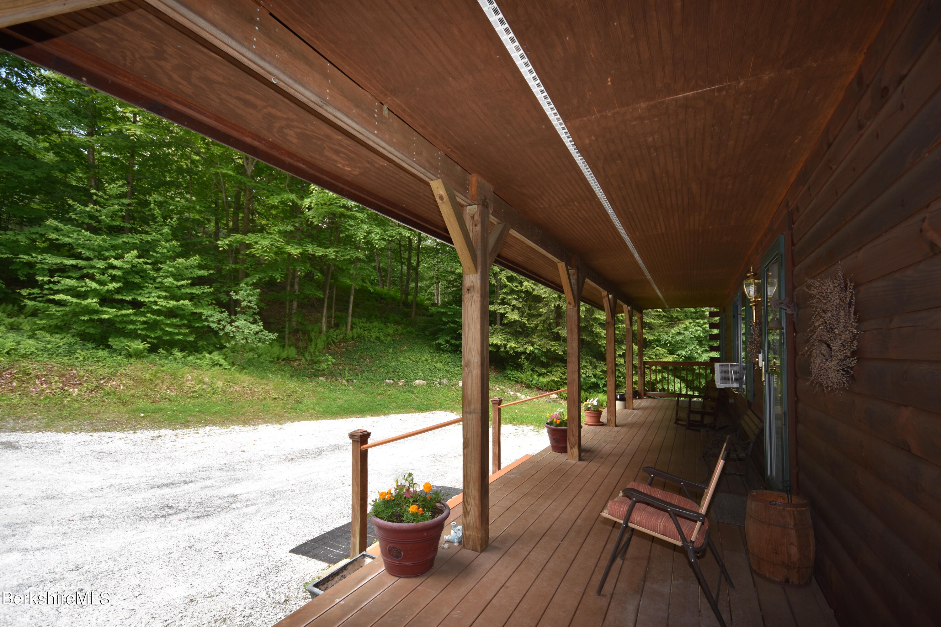 136 North Washington State Road Washington, MA 01223 - Photo 3 of 40 a view of porch with a table chairs and a patio