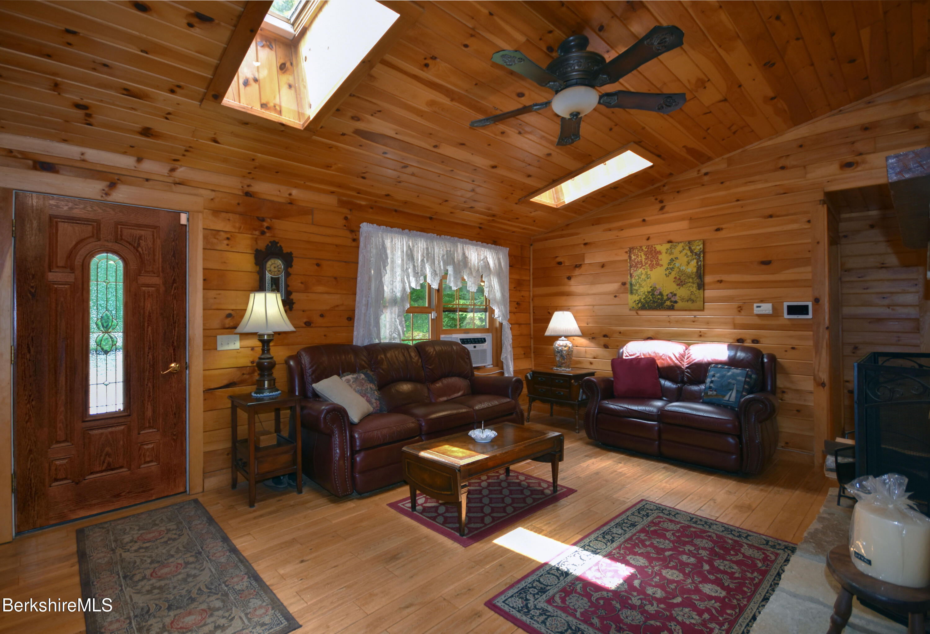 136 North Washington State Road Washington, MA 01223 - Photo 4 of 40 a living room with furniture a ceiling fan and a rug